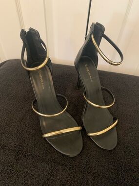 bebe Black Stiletto Sandals with Gold Hoop Straps